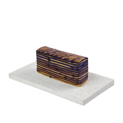 Kek Lapis Blueberry, cut to show the layers